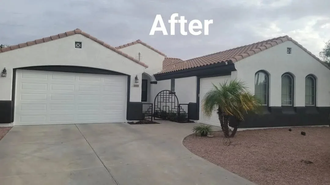 The same Peoria, Arizona home after exterior repainting with crisp white walls and black trim